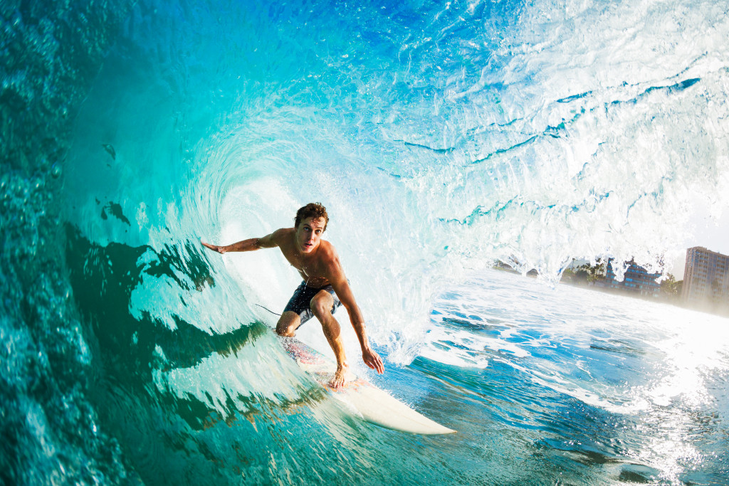 man surfing in waves